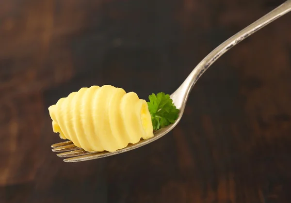 Máslo stočené na vidličku — Stock fotografie