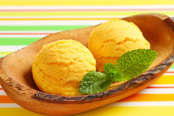 Ice cream served in natural wood bowl — Stock Photo, Image