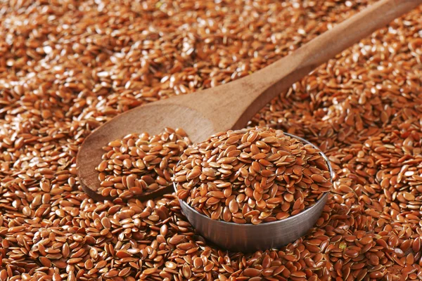 Brown flax seeds background — Stock Photo, Image