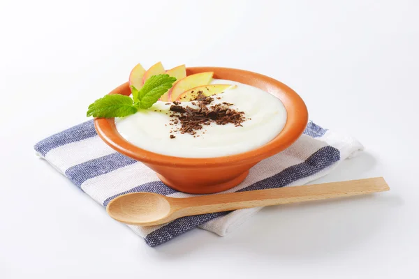 Semolina or rice pudding with apple and chocolate — Stock Photo, Image
