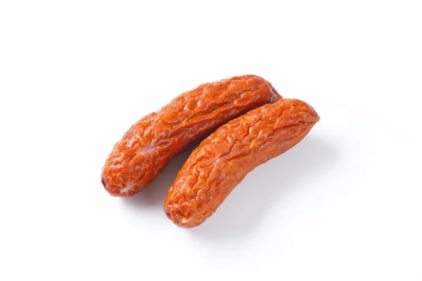 Kielbasa worstjes op witte achtergrond — Stockfoto