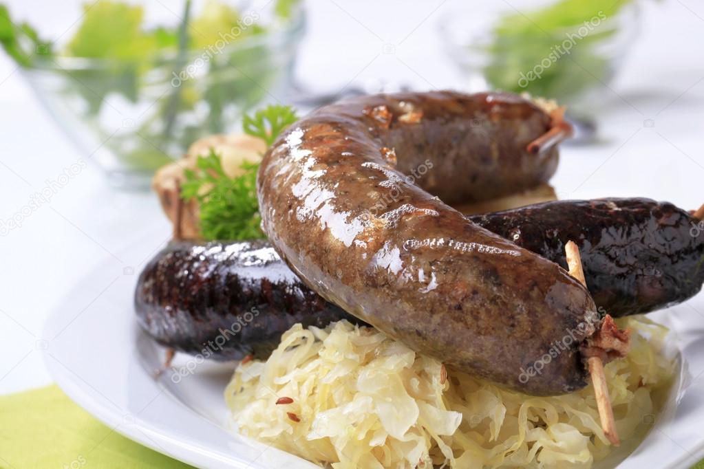 Pan fried sausages with sauerkraut — Stock Photo © ajafoto 63243621