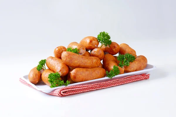 Pile of Polish sausages on plate — Stock Photo, Image