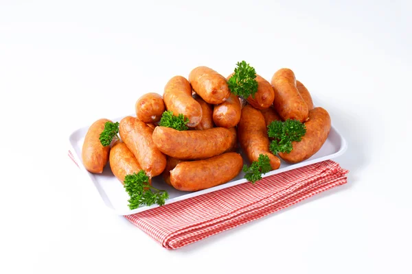 Pile of Polish sausages on plate — Stock Photo, Image