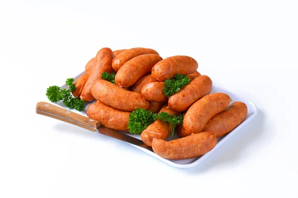 Pile of pork sausages on plate — Stock Photo, Image