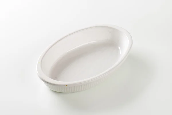 Deep oval porcelain dish — Stock Photo, Image