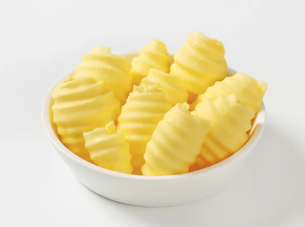 Bowl of butter curls — Stock Photo, Image