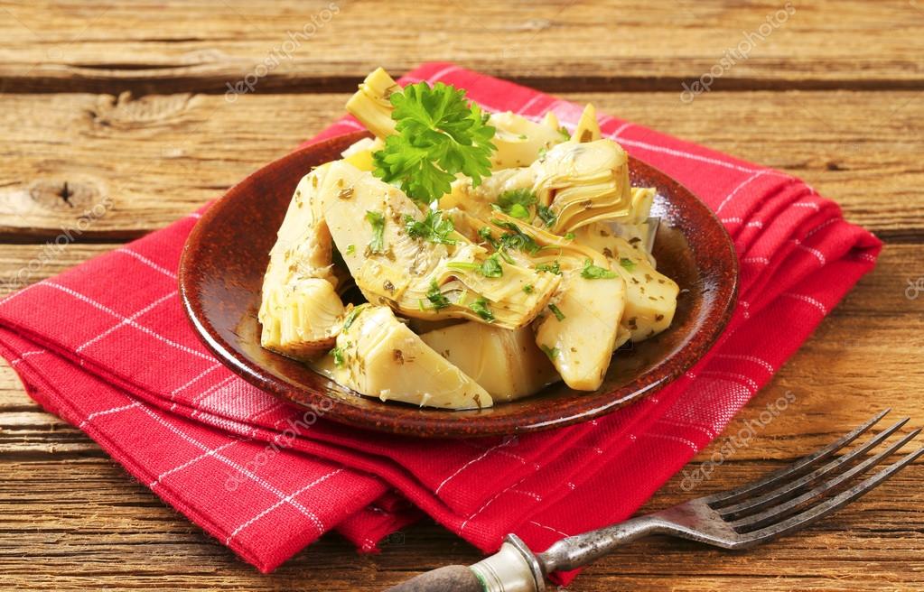 Marinated artichoke hearts Stock Photo by ©ajafoto 65789673