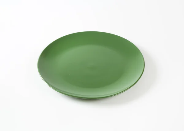Placa de jantar verde maciça redonda — Fotografia de Stock