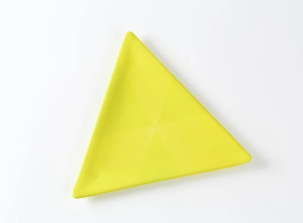 Yellow triangle plate — Stock Photo, Image