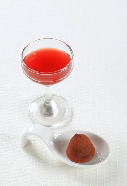 Chocolate truffle and fruit coulis — Stock Photo, Image