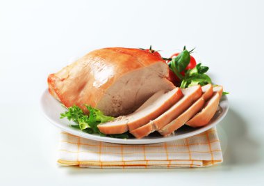 Roast turkey breast on a plate clipart
