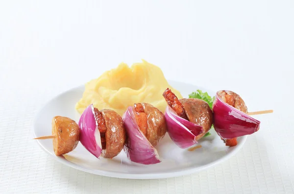 Bacon and potato skewer with mashed potato — Stock Photo, Image