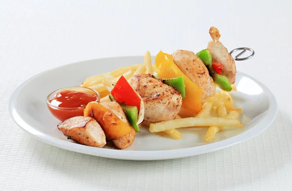 Chicken Shish kebab with French fries — Stock Photo, Image