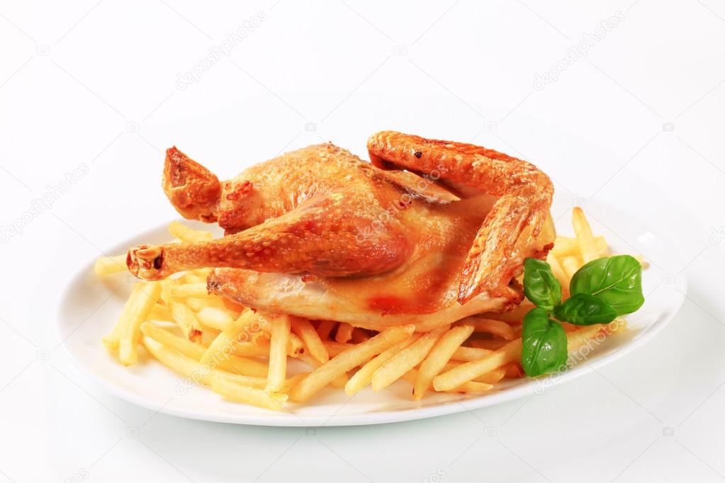 Crispy roast chicken with French fries