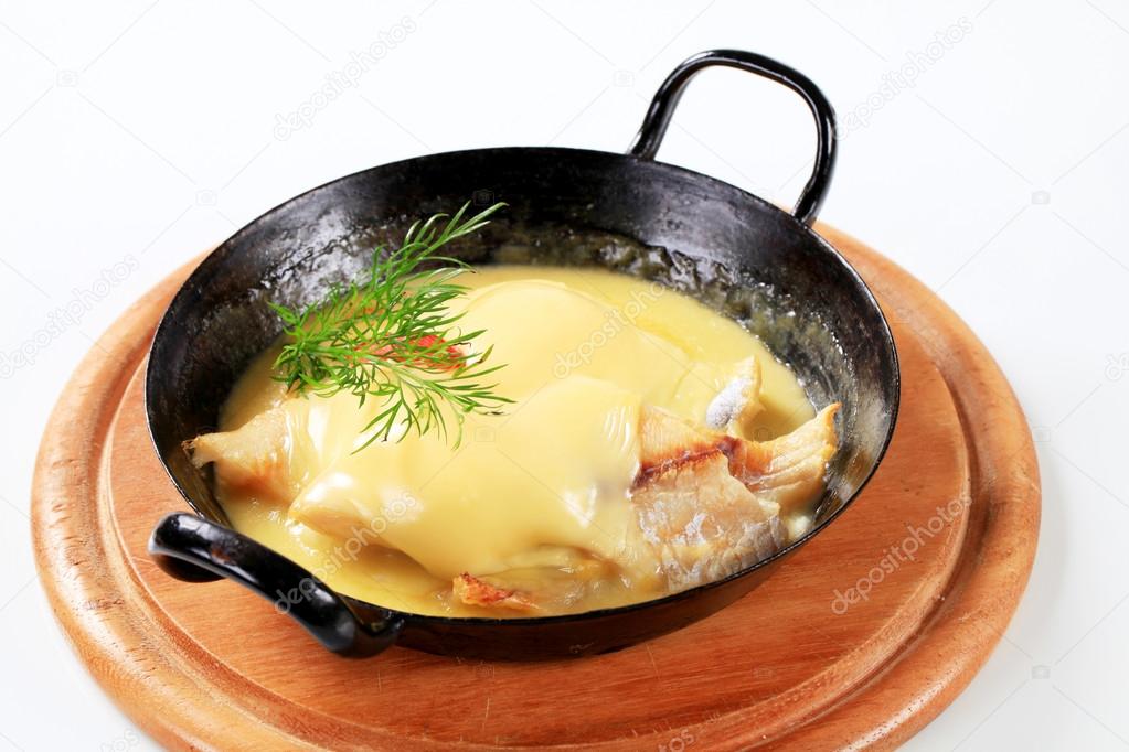 Pan seared fish with thick cheese sauce 