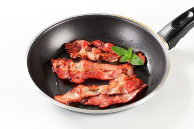 Pan fried bacon strips clipart