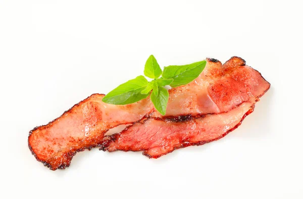 Pan fried bacon strips — Stock Photo, Image