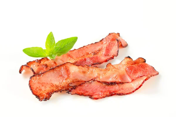 Pan fried bacon strips — Stock Photo, Image