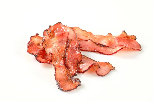 Pan fried bacon strips — Stock Photo, Image