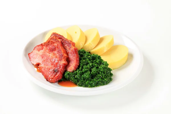 Smoked pork neck with potato dumplings and spinach — Stock Photo, Image