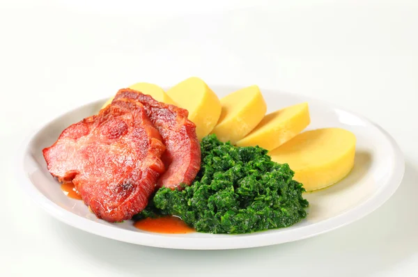 Smoked pork neck with potato dumplings and spinach — Stock Photo, Image