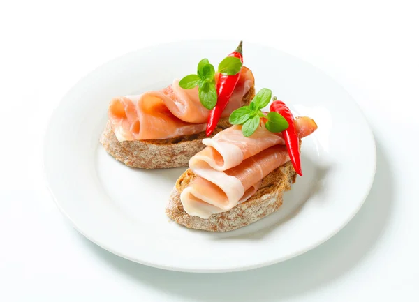 Prosciutto open faced sandwiches — Stock Photo, Image