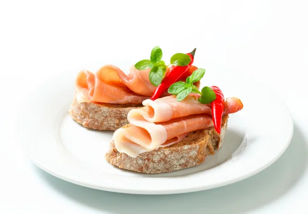 Prosciutto open faced sandwiches — Stock Photo, Image