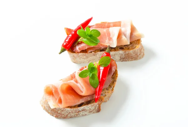 Prosciutto open faced sandwiches — Stock Photo, Image
