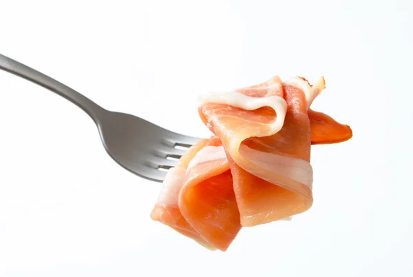 Prosciutto on a fork — Stock Photo, Image