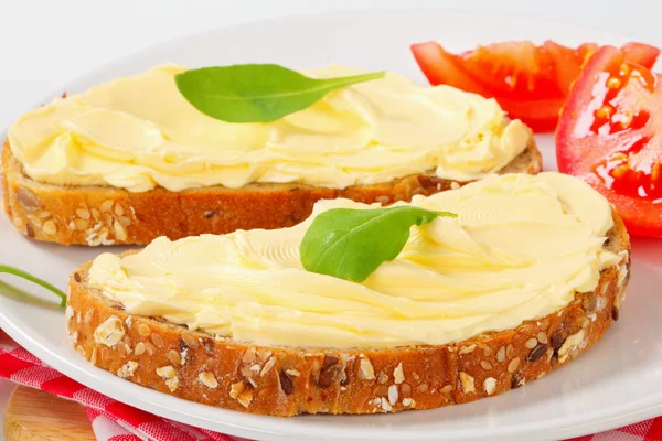 Whole grain bread with butter — Stock Photo, Image