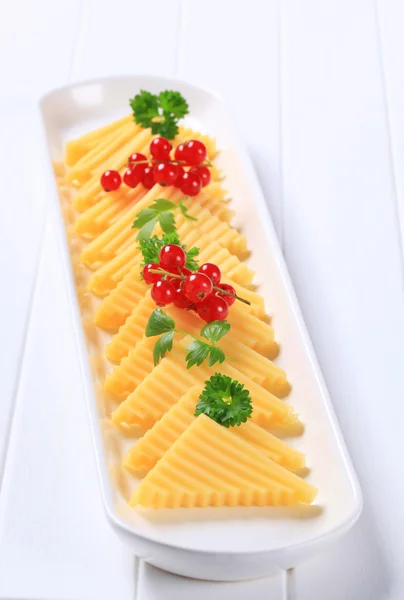 Cheese cut into triangles — Stok fotoğraf