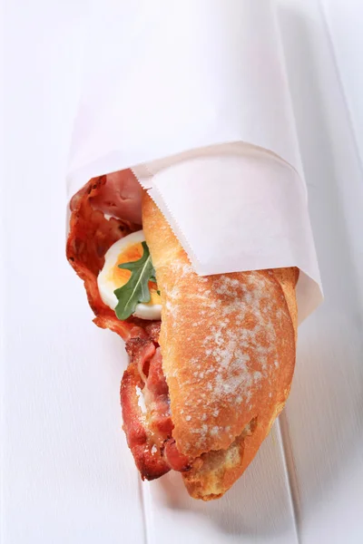 Bread roll with bacon — Stock Photo, Image