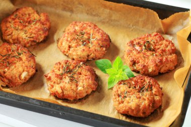 Vegetable burgers on baking parchment paper