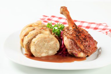 Roast duck leg with bread dumplings and red cabbage
