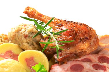 Roast duck leg and smoked pork with dumplings