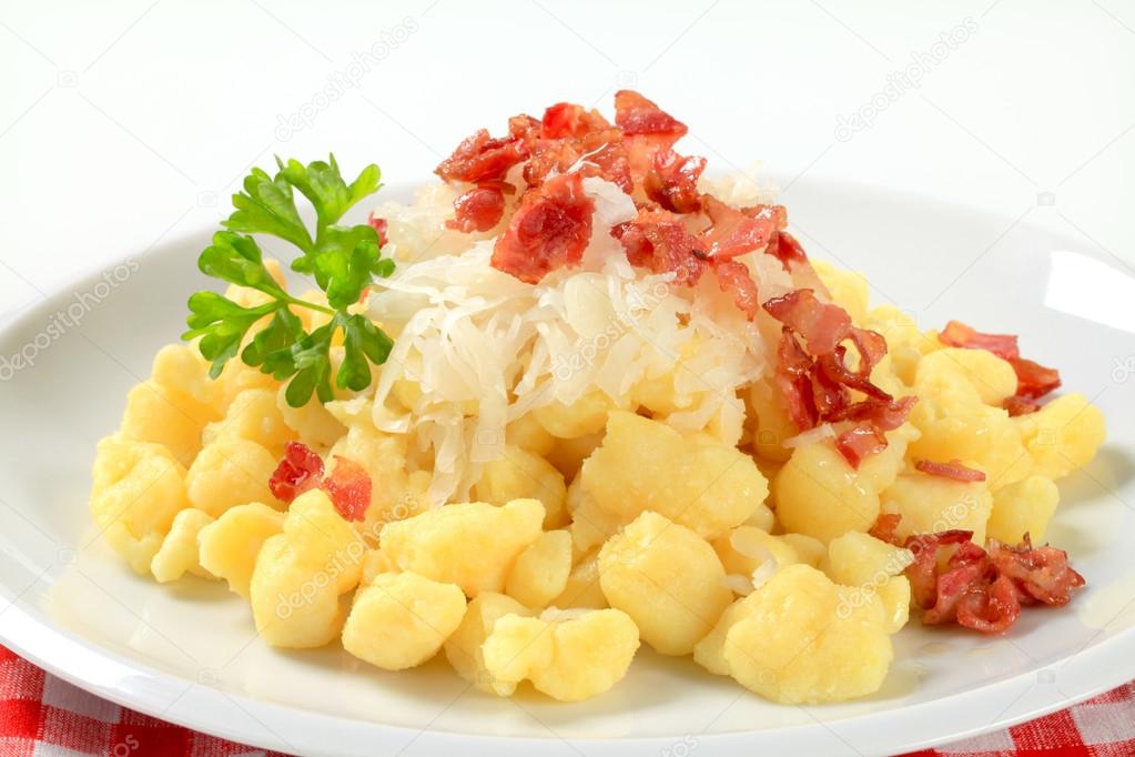 Small potato dumplings with bacon and cabbage
