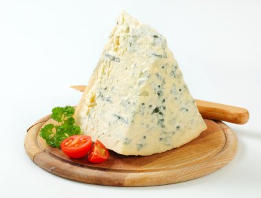 Blue cheese on a cutting board clipart