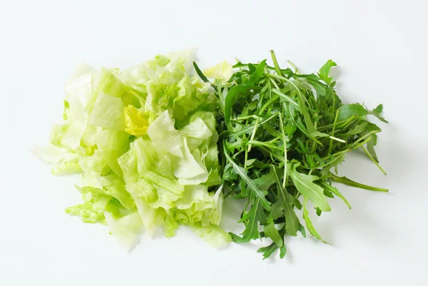 Iceberg lettuce and arugula — Stock Photo, Image