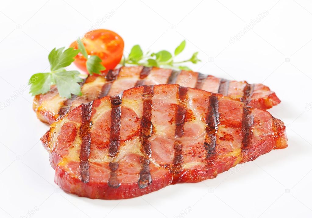 Grilled pork neck steaks