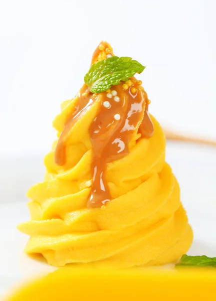 Yellow cream with caramel sauce — Stock Photo, Image