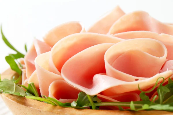 Rocket salad and sliced ham — Stock Photo, Image