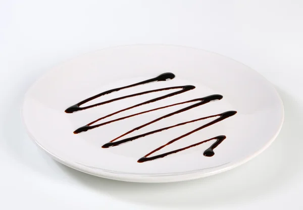 Gotejamento de xarope de chocolate — Fotografia de Stock