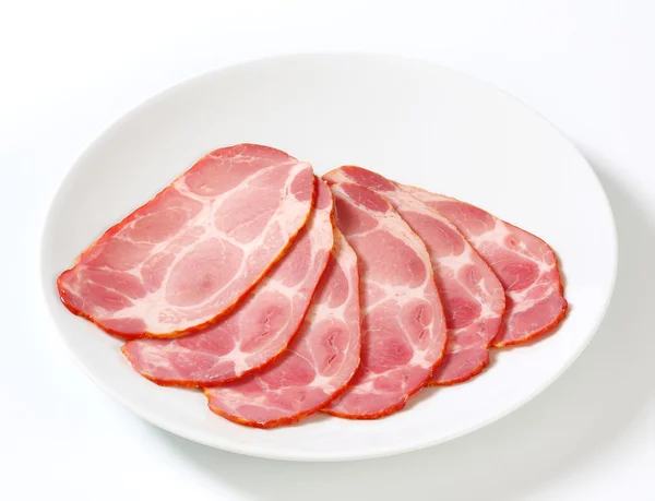 Slices of smoked pork neck — Stock Photo, Image