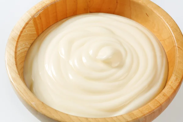 Creamy sauce in wooden bowl — Stock Photo, Image