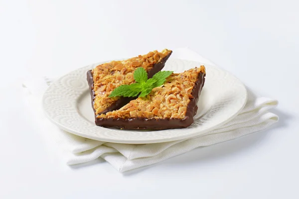 Triangle nut bars dipped in chocolate — Stock Photo, Image