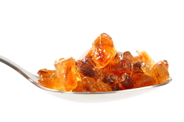 Zucchero di roccia marrone su cucchiaio — Foto Stock