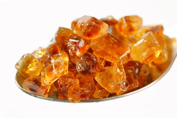 Zucchero di roccia marrone su cucchiaio — Foto Stock