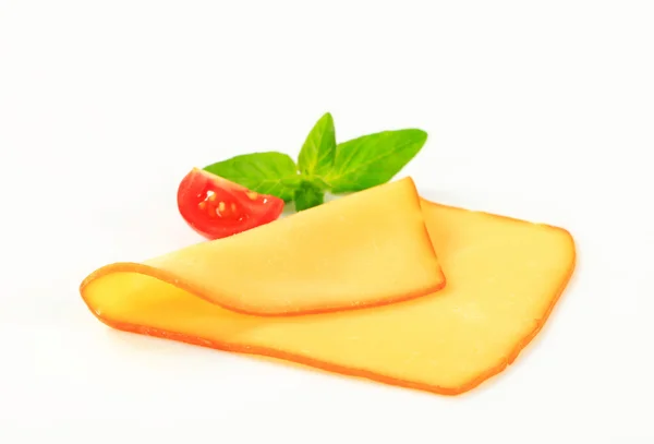 Slice of smoked cheese — Stock Photo, Image