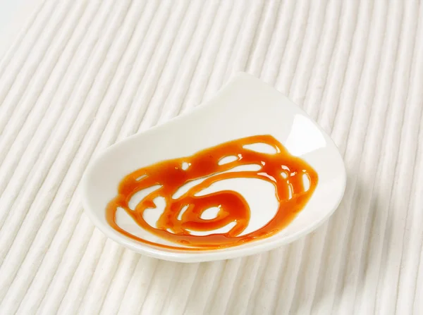 Caramel drizzle sauce — Stock Photo, Image